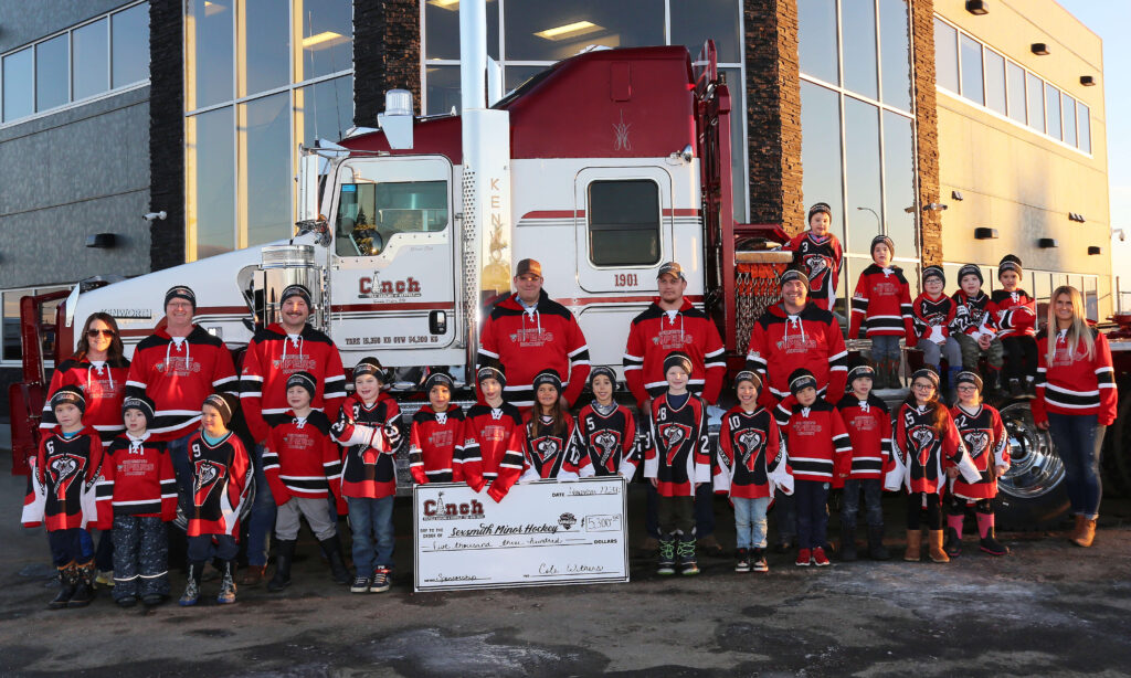 Cinch team and equipment gathered in a yard